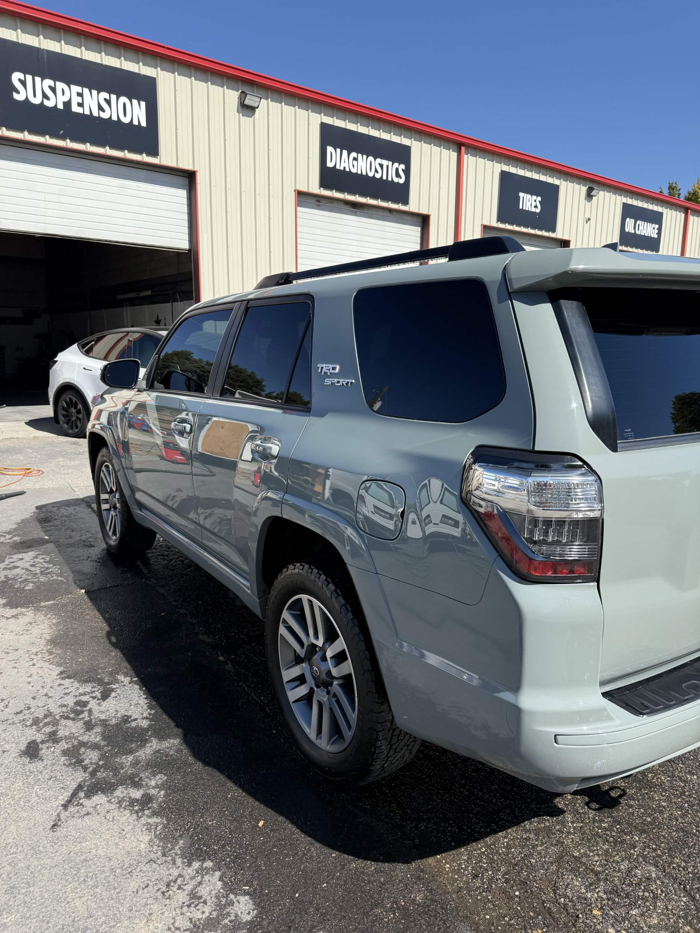 Grey Toyota 4Runner TRD Sport SUV freshly washed in a service lot